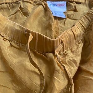 100% Silk drawstring pants. Golden color.